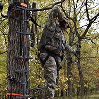 Hunting Safety Bow hunter in a tree stand