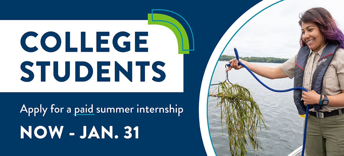 College student intern boating on a lake.